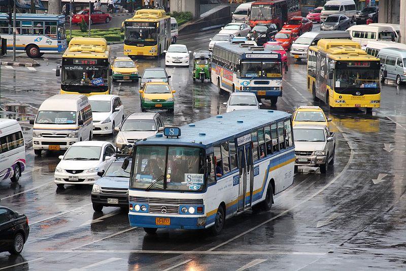 A large number of buses, minibuses and taxis share the streets with private vehicles at Victory Monument, a major public transport hub.