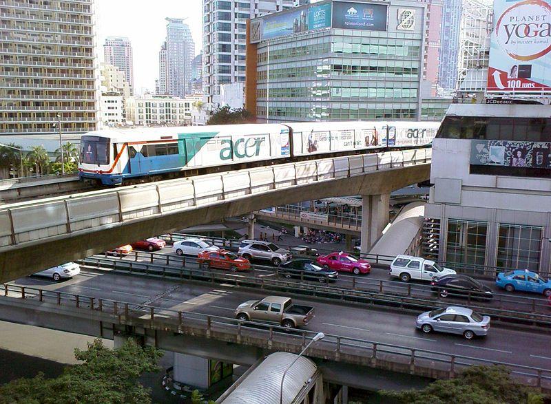 A BTS train passes over the busy Sala Daeng Intersection. The MRT also crosses below the street at this location.